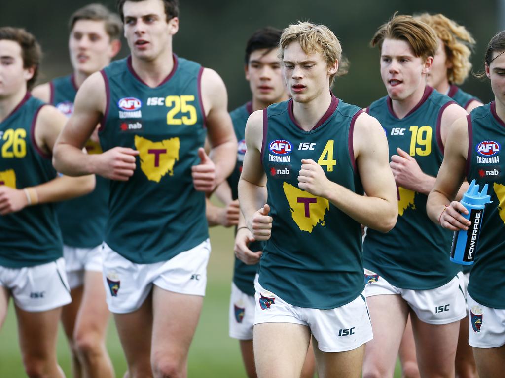 AFL - Tasmania Devils under-18 team in NAB League game against the Northern Knights at Twin Ovals, Kingston. (L-R)The team running on the field after the half time break. Picture: MATT THOMPSON