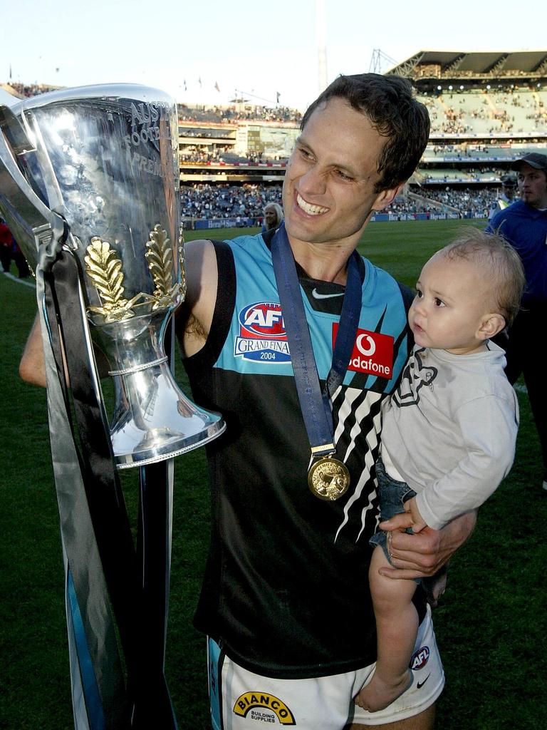 Gavin Wanganeen and son Tex after Port Adelaide’s 2004 grand final win.