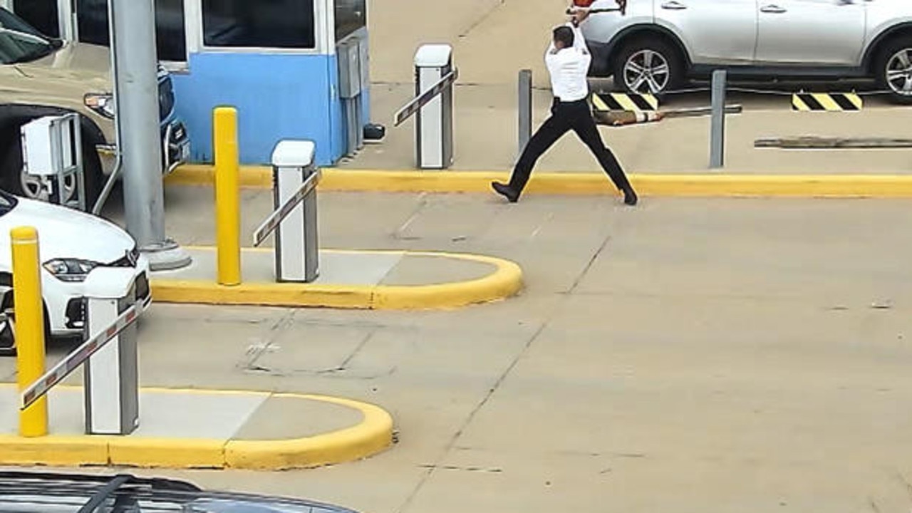 Mr Jones was seen whacking the gate 23 times before it broke. Picture: CBS News.