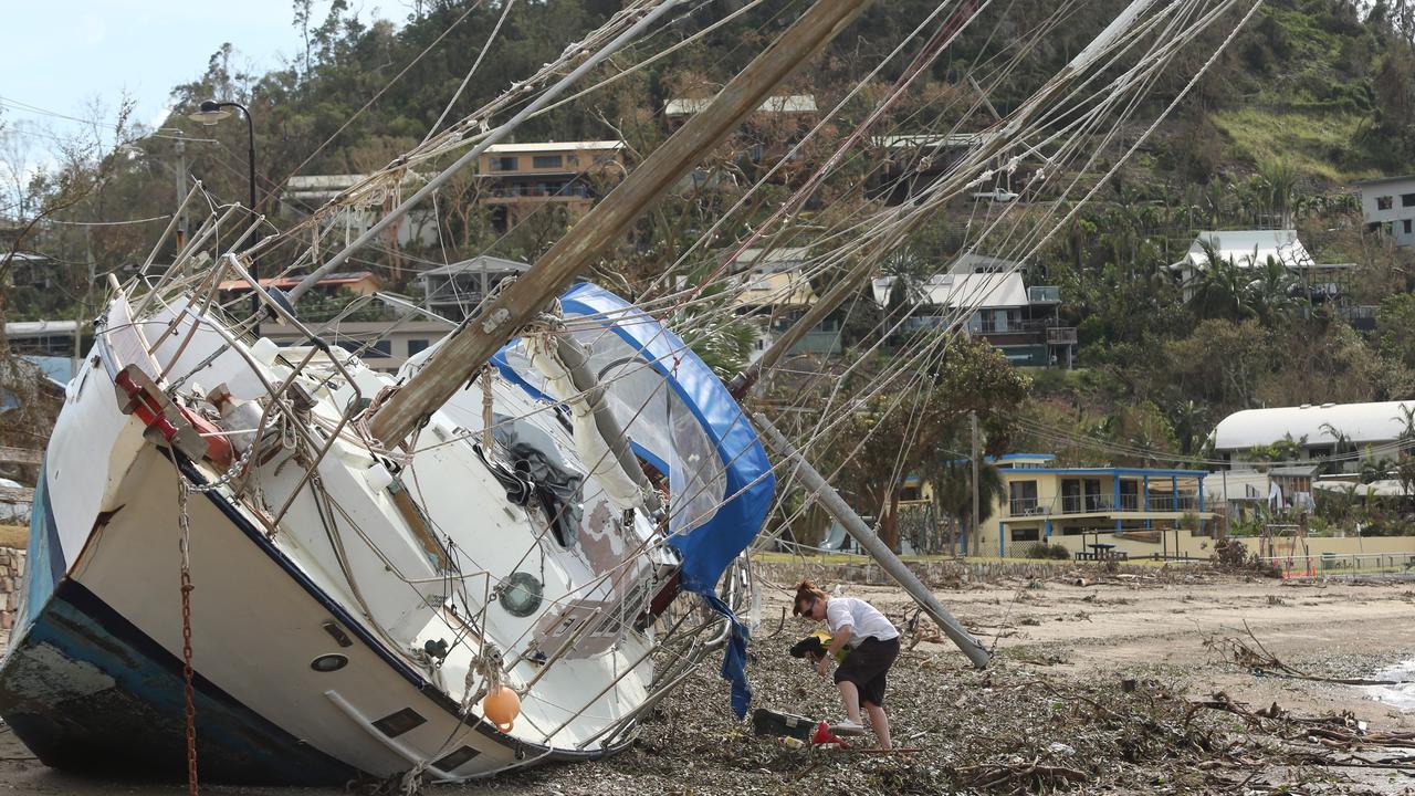 A yacht high and dry after category 4 storm, Cyclone Debbie. Picture: Jono Searle.