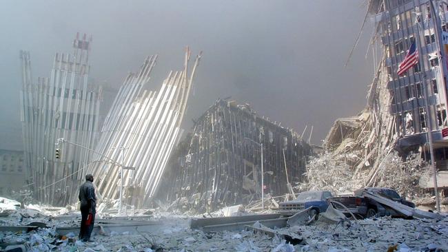 A man covered in dust surveys the wreckage of the World Trade Centre in New York after the September 11 attack. Picture: Doug Kanter/AFP