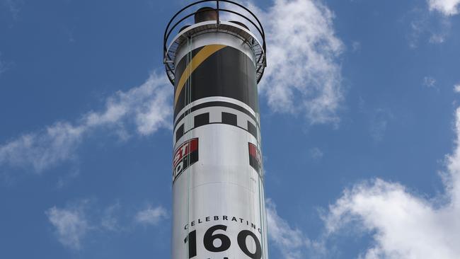 The Glenelg colours will be above the Port Adelaide ones for the next 12 months at the West End Brewery chimney. Picture: Tait Schmaal.