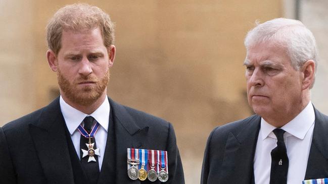 Britain's Prince Harry, Duke of Sussex (L) talks with Britain's Prince Andrew, Duke of York as they arrive at St George's Chapel inside Windsor Castle on September 19, 2022, ahead of the Committal Service for Britain's Queen Elizabeth II. - Monday's committal service is expected to be attended by at least 800 people, most of whom will not have been at the earlier State Funeral at Westminster Abbey. (Photo by David Rose / POOL / AFP)