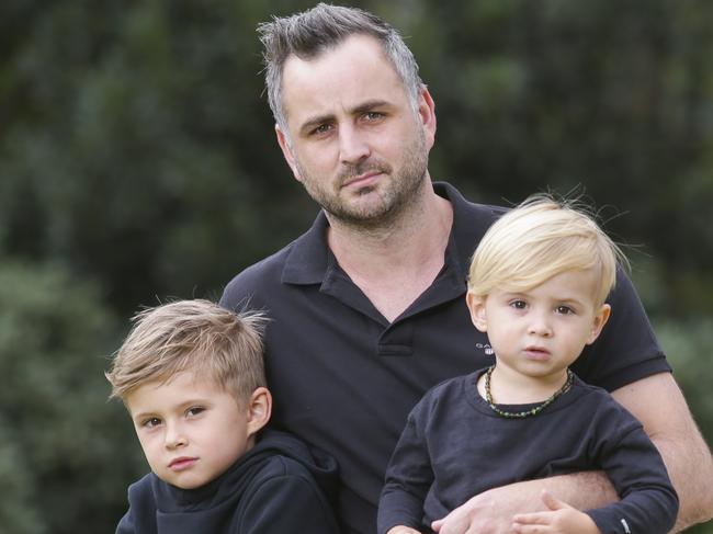 Former AFL player Ty Zantuck, picture here with his kids Jagger and Zepplin, says his former club mismanaged his injury. Picture: Wayne Taylor