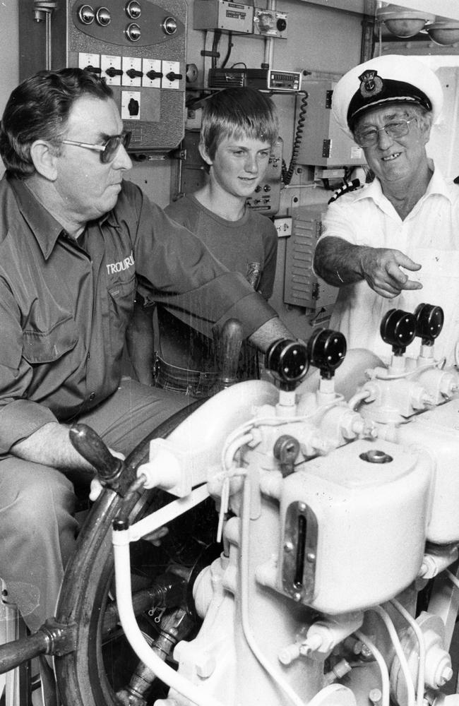 Captain David Gibson and seaman Bob Innes explain the bridge controls to Darren Walker, 14, of Bridgewater, in 1982.