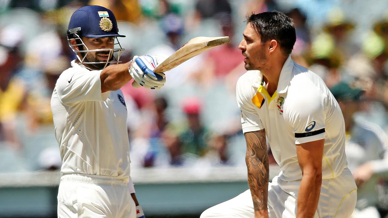 Virat Kohli and Mitchell Johnson come together at the MCG during the 2014 Test.