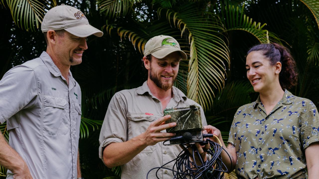 Australia Zoo crocodile sounds research with honours student Sonnie Flores (right).