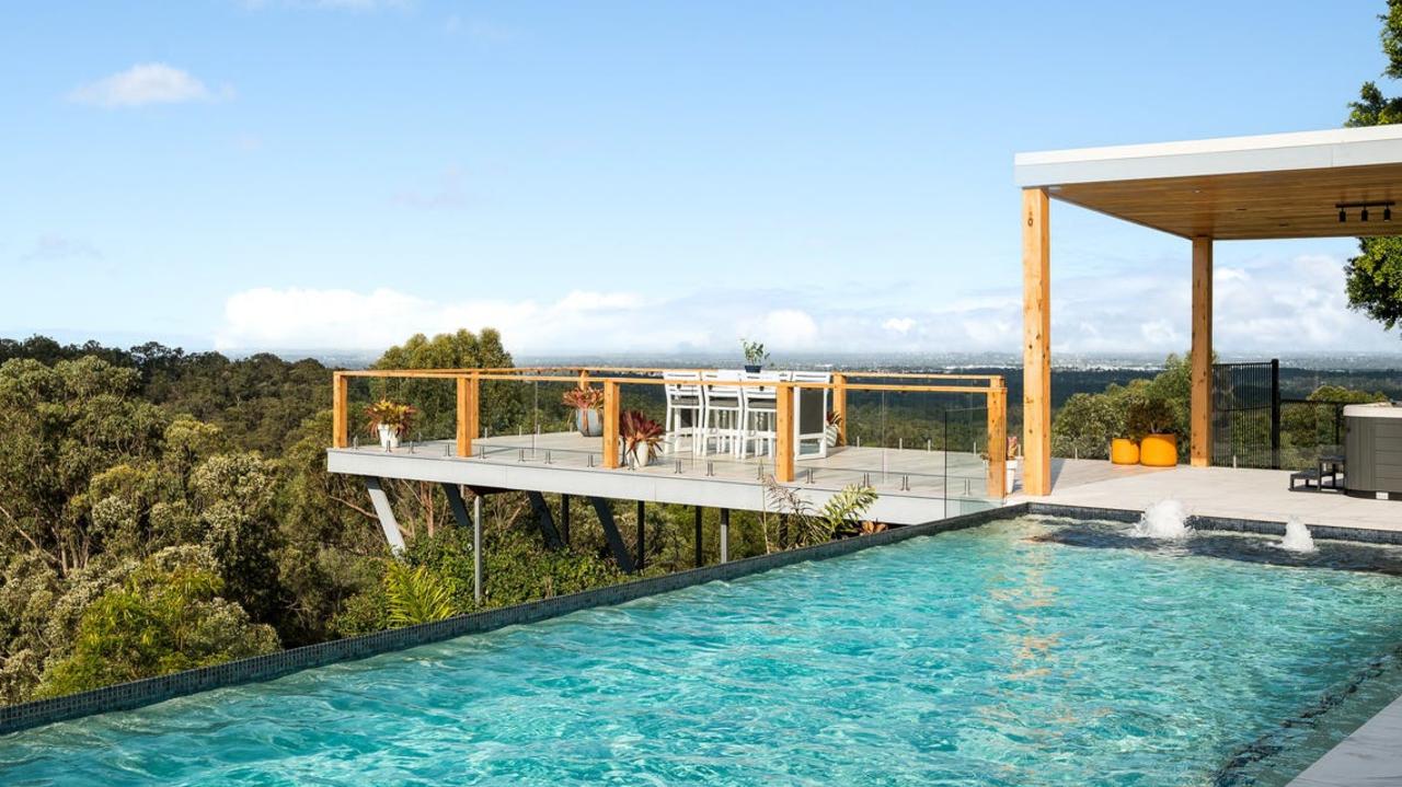 The Clear Mountain home has a deck that protrudes out past the pool.