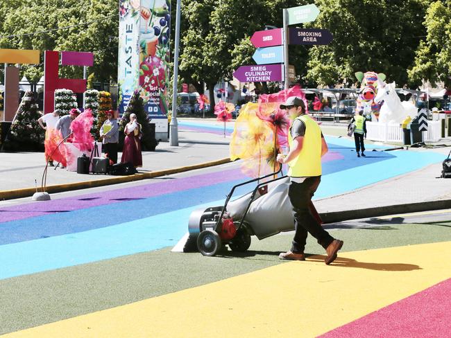 The rainbow grass gets a quick cleanup in preparation for Tuesday’s Taste visitors. Picture: MATHEW FARRELL