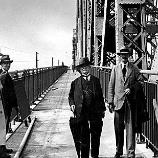 Consulting engineer Dr JJC (John) Bradfield and LR Wilson, chief engineer for steel construction, walk off the Story Bridge after the suspension span had been joined in 1939.