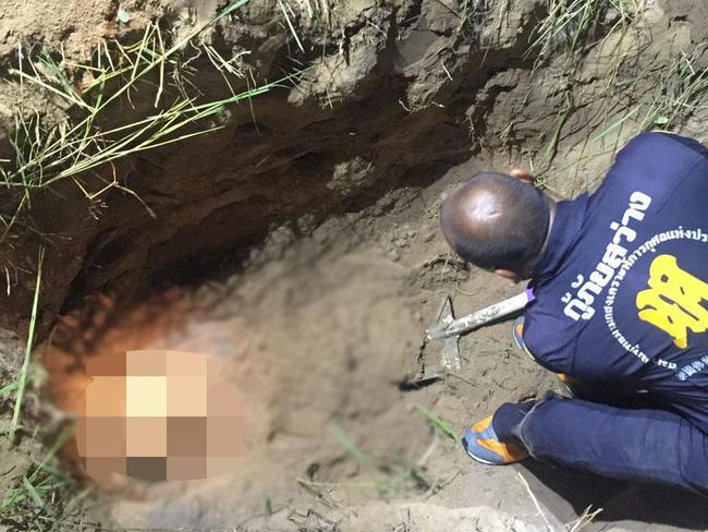 Thai police examine the shallow grave where the body of Hells Angels bikie Wayne Schneider was found at Chon Buri, Thailand in 2015.