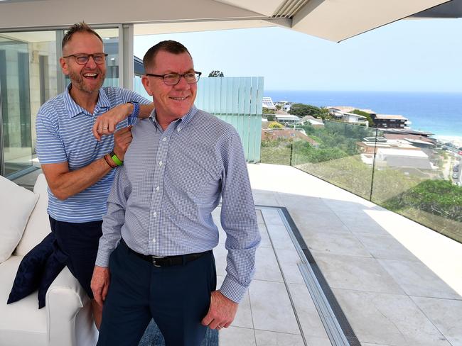 Fred Balboni (blue white short sleeve), 60, and partner Geoff Collins, 56, pose for a picture in Tamarama, Sydney, Friday, 3 January 2020. Mr Balboni says it is a happy coincidence that they are selling in the rising market. Picture - Sam Mooy/The Australian