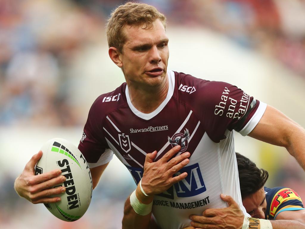 GOLD COAST, AUSTRALIA - JUNE 29: Tom Trbojevic of the Sea Eagles is tackled during the round 15 NRL match between the Gold Coast Titans and the Manly Sea Eagles at Cbus Super Stadium on June 29, 2019 in Gold Coast, Australia. (Photo by Chris Hyde/Getty Images)