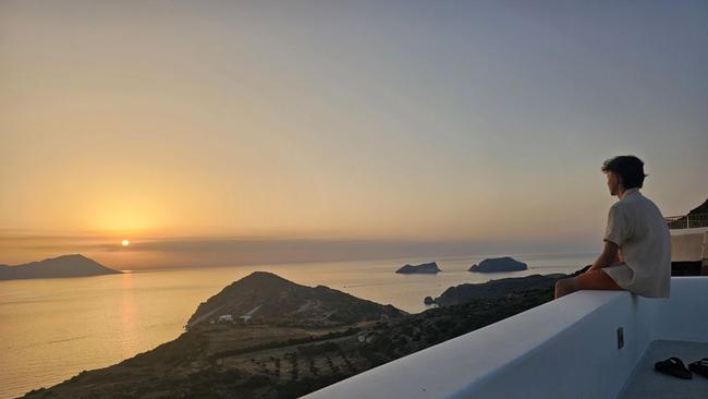 Alex Yurkiv watching the sunset in Greece with his brothers Dan and Bogdan.