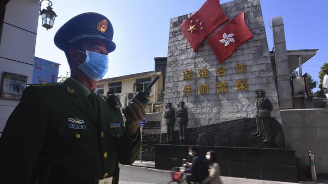 A paramilitary police officer stands guard in an area near the border with Hong Kong in Shenzhen in southern China's Guangdong Province. Picture: AP