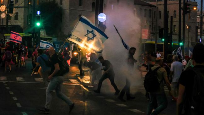 Police use water canon against protesters in Jerusalem just hours before Ireland, Spain and Norway said they would recognise a Palestinian state. Picture: AFP