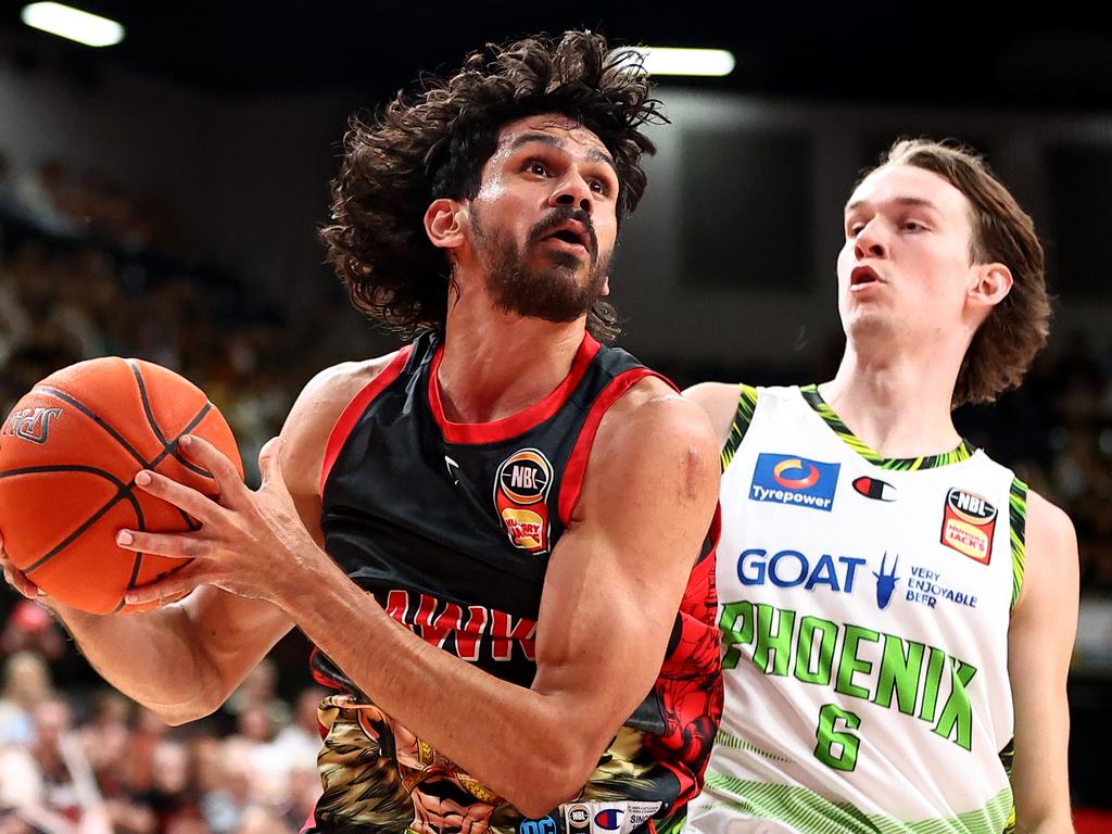 William Hickey of the Hawks drives to the basket under pressure from Kody Stattmann. Picture: Jeremy Ng/Getty Images