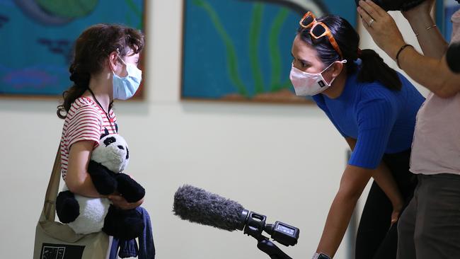 A young traveler from New Zealand talks to the media upon arrival at Brisbane Airport. Picture: Jono Searle/Getty Images