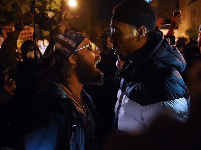 A Trump supporter clashes with a demonstrator at Black Lives Matter plaza across from the White House on election day in Washington, DC. Picture: AFP