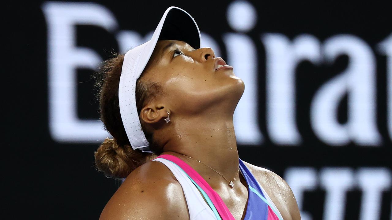 MELBOURNE, AUSTRALIA - JANUARY 21: Naomi Osaka of Japan reacts after losing a point in her third round singles match against Amanda Anisimova of United States during day five of the 2022 Australian Open at Melbourne Park on January 21, 2022 in Melbourne, Australia. (Photo by Mark Metcalfe/Getty Images)