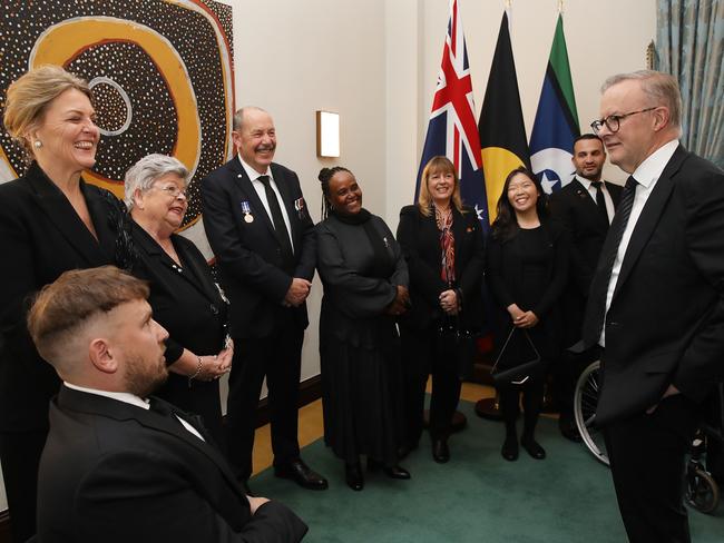 Anthony Albanese welcomes nine Everyday Australians at the Australian High Commission. They were invited directly by the Queen. Picture: Ella Pellegrini