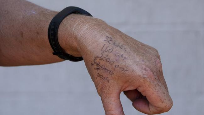 Kangaroo Island farmer Kate Stanton wrote her fencing requirements on her hand before she placed her order. Her property needed at least 32km of new fencing, 160 rolls of wire and more than 3200 posts. Picture: Emma Brasier/AAP