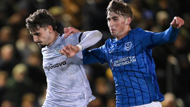 PORTSMOUTH, ENGLAND - JANUARY 28: Hayden Matthews of Portsmouth challenges Mihailo Ivanovic of Millwall during the Sky Bet Championship match between Portsmouth FC and Millwall FC at Fratton Park on January 28, 2025 in Portsmouth, England. (Photo by Mike Hewitt/Getty Images)