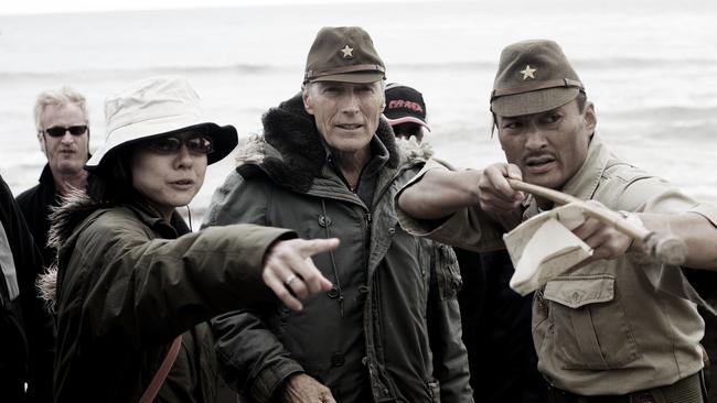 Eastwood, centre, with interpreter Yuki Ishimaru (left) and actor Ken Watanabe during filming of film Letters from Iwo Jima (2006).