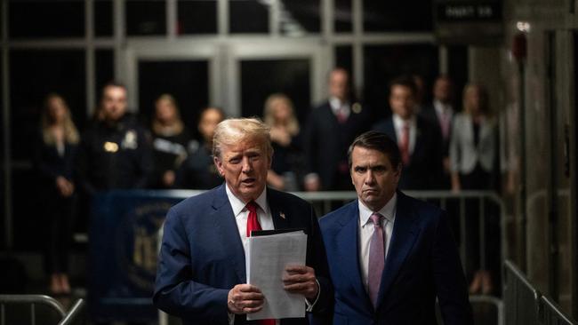 Former US President Donald Trump, with his lawyer Todd Blanche, speaks to the press at the end of the day of his hush money trial on May 16. Picture: Victor J. Blue / POOL / AFP