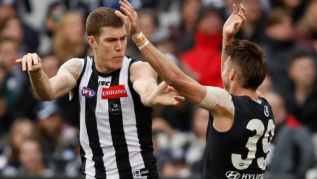 Mason Cox and Dale Thomas engage in some push and shove. Picture: Getty Images