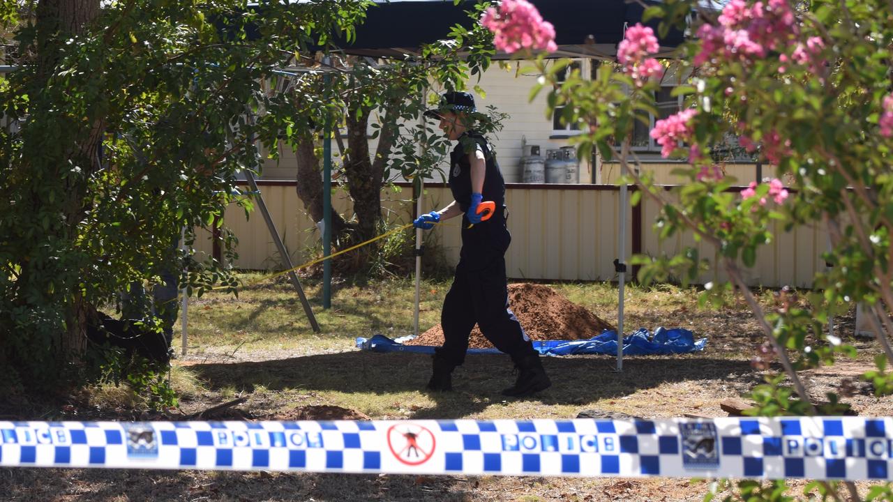 BACK YARD DIG: Investigators excavating the back yard of the Burbank St Address in Chinchilla.