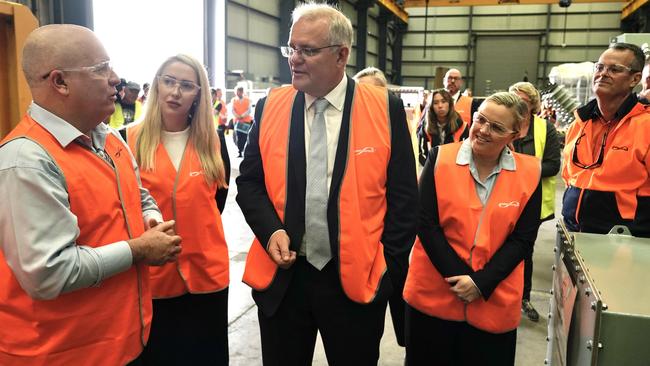 Ms Vitnell (second from left), Mr Morrison and others touring an Ampcontrol workshop. Picture: Adam Taylor