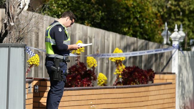 Police at the scene of the tragic house fire. Picture: Alison Wynd