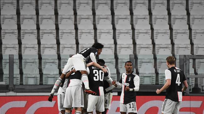 Serie A powerhouse Juventus celebrates a goal in front of an empty stadium.