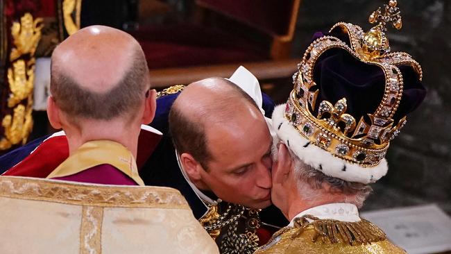 Prince William kisses King Charles III inside Westminster Abbey. Picture: AFP