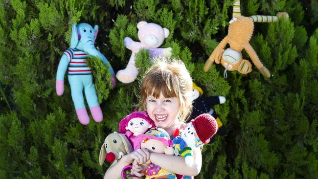 Chelsea Bragg, 4, is on the hunt for bears around Sandgate. Picture: AAP/Renae Droop