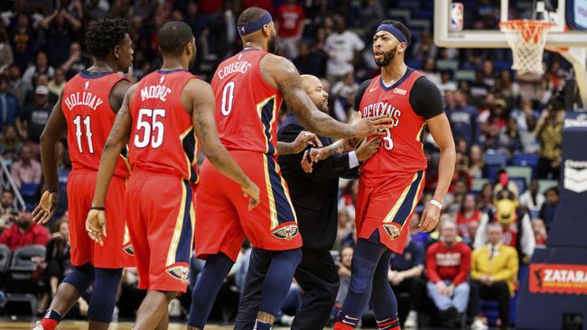New Orleans Pelicans' DeMarcus Cousins and teammates try to calm down Anthony Davis as he is ejected.