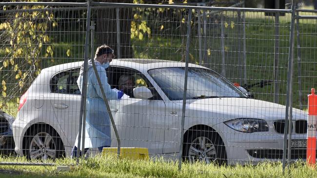 People queue for a COVID test at Albert Park Lake. Picture: NCA NewsWire / Andrew Henshaw