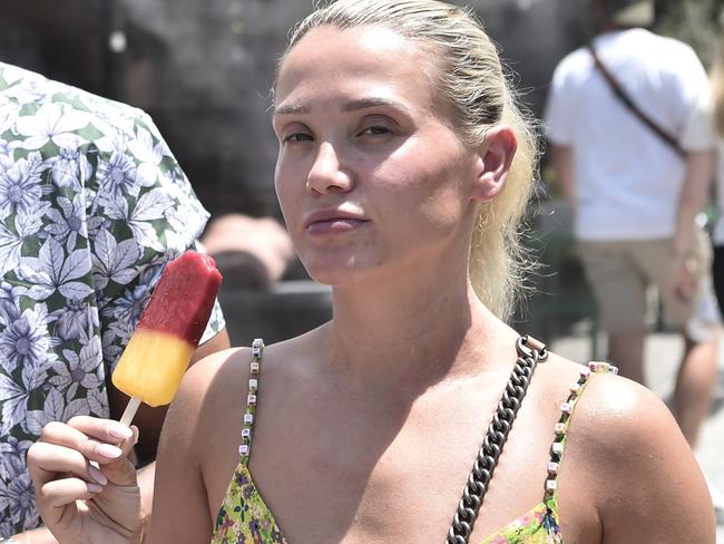 ATHENS, GREECE - JULY 20: Tourist in Plaka, eat ice cream to cool off during a heat wave on July 20, 2023 in Athens, Greece. The Acropolis of Athens and other archaeological sites in Greece announced reduced opening hours due to the heatwave conditions. Parts of Europe continue to experience extreme conditions of the Cerberus heatwave, dubbed Charon. (Photo by Milos Bicanski/Getty Images)