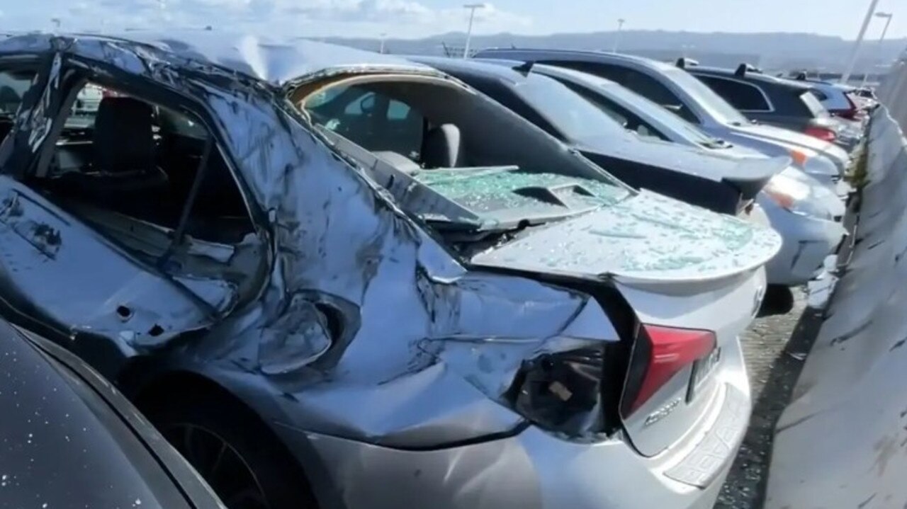 A car is seen crushed after a tyre fell off a jet during takeoff. Picture: CBS