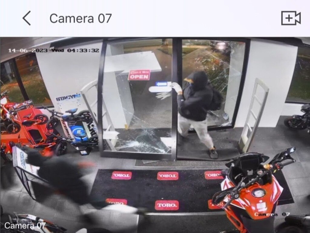 The offenders captured on Gladstone Motorcycles CCTV.