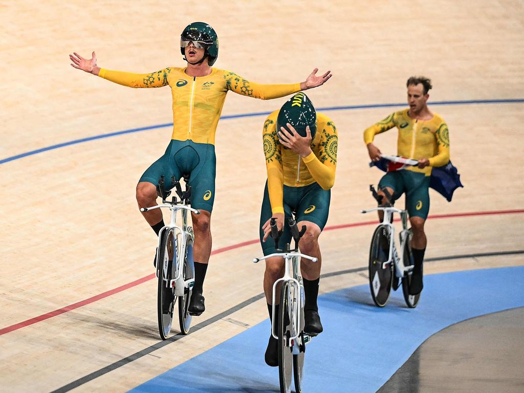 Australia's Oliver Bleddyn, Conor Leahy and Sam Welsford try to absorb the realisation that they have won the gold. Picture: Sebastien Bozon/AFP