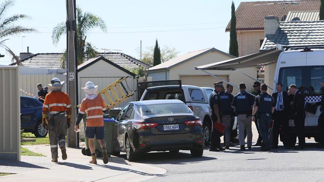 Forensic Officers and Crime scene investigators at the scene of the fatal fire at Woodville West. Picture: Emma Brasier.