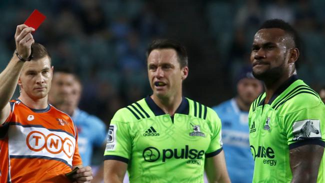 Highlanders winger Tevita Nabura (right) is marched after he kicked the Waratahs’ Cameron Clark in the face.