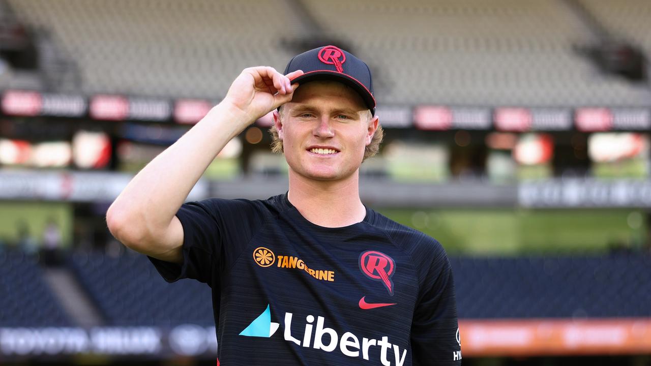 Ollie Peake of the Renegades poses for a photo with their debut caps prior to the BBL match between Melbourne Renegades and Brisbane Heat at Marvel Stadium, on January 18, 2025, in Melbourne, Australia. (Photo by Mike Owen/Getty Images)