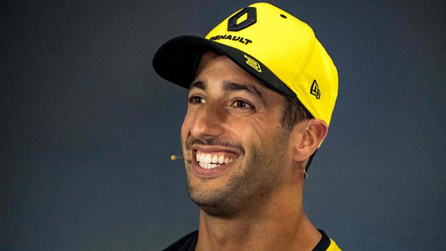 (FILES) In this file photo taken on July 11, 2019 Renault's Australian driver Daniel Ricciardo smiles during the drivers' press conference at Silverstone motor racing circuit in Silverstone, central England, on July 11, 2019 ahead of the British Formula One Grand Prix. - Australian Daniel Ricciardo will drive for McLaren in Formula One next season after signing a "multi-year" deal that will see him replace Ferrari-bound Carlos Sainz, the British team announced on May 14, 2020. (Photo by ANDREJ ISAKOVIC / AFP)