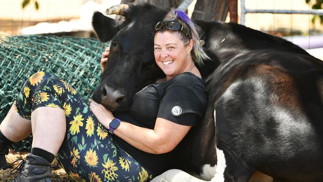 Trish Prendergast with her 3yo Dairy Steer 'Nemoo the Grass Puppy' who's helping people through the new wellness trend of 'cow hugging'. Picture: Alix Sweeney