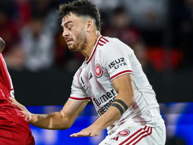 ADELAIDE, AUSTRALIA - DECEMBER 27:Ben Folami of Adelaide United   competes with  Dylan Scicluna of the Wanderers  during the round 10 A-League Men match between Adelaide United and Western Sydney Wanderers at Coopers Stadium, on December 27, 2024, in Adelaide, Australia. (Photo by Mark Brake/Getty Images)