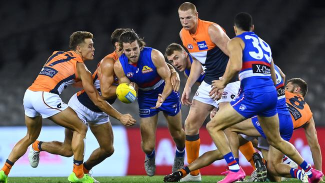 Bulldogs’ Marcus Bontempelli handballs out of a crowd during the Dogs’ win over the Giants at Marvel Stadium on Friday night. Picture: Getty Images