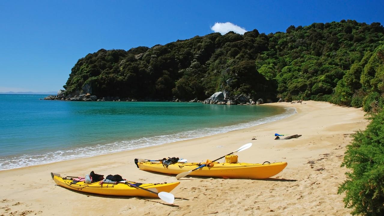 A New Zealand man has drowned at a beach after trying to save a child from the same fate.